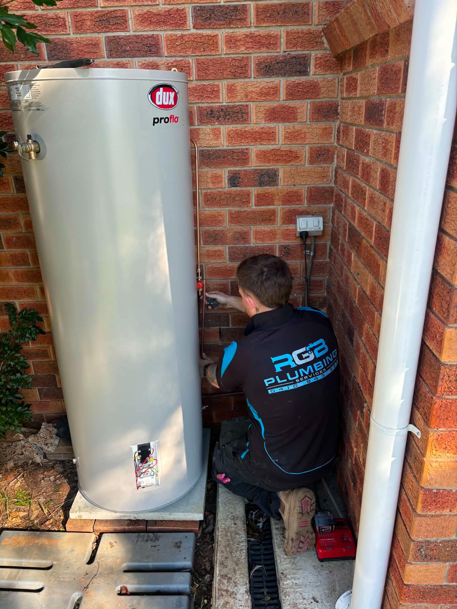 Rhys working on a hot water system
